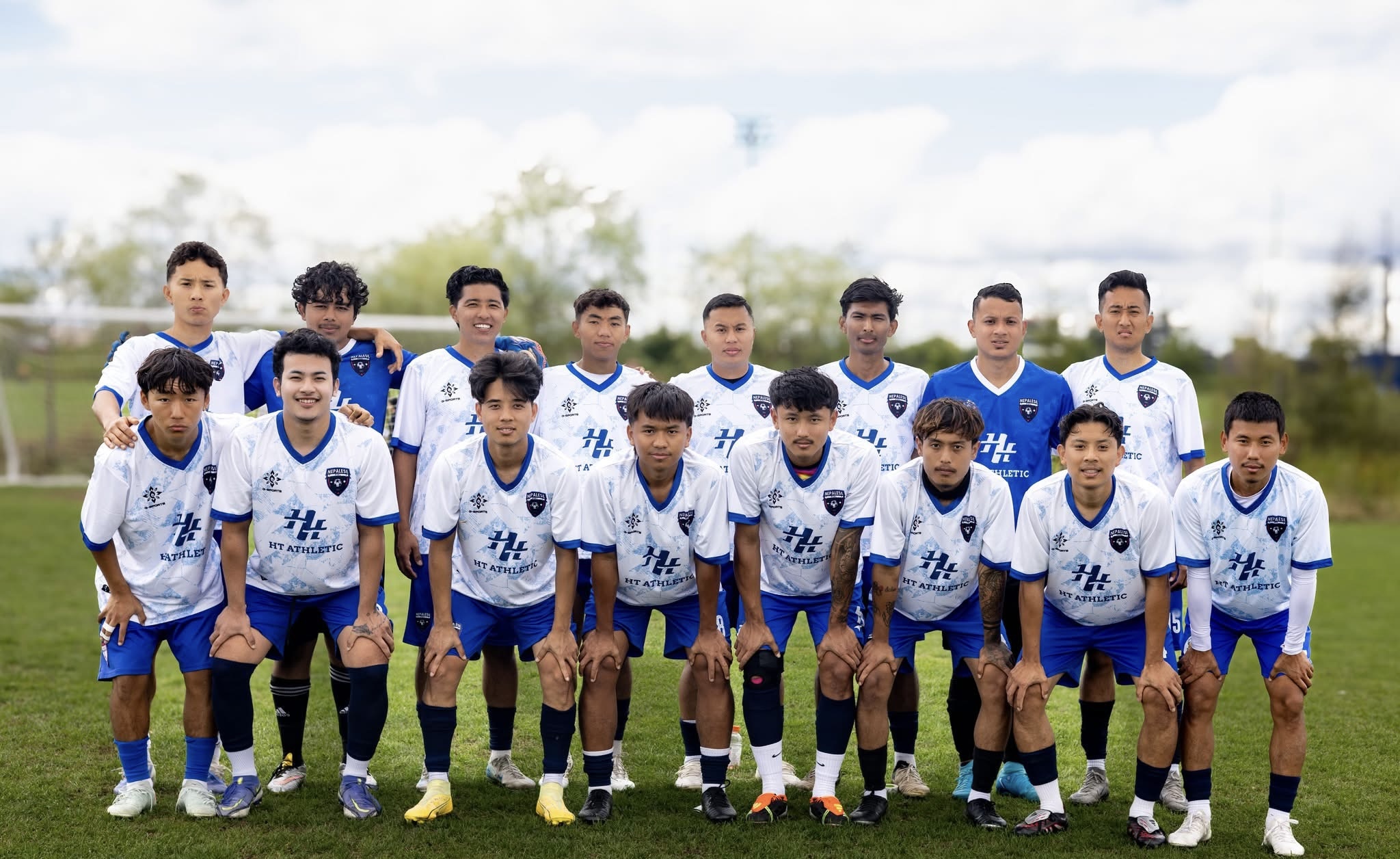 Soccer team posing together outdoors