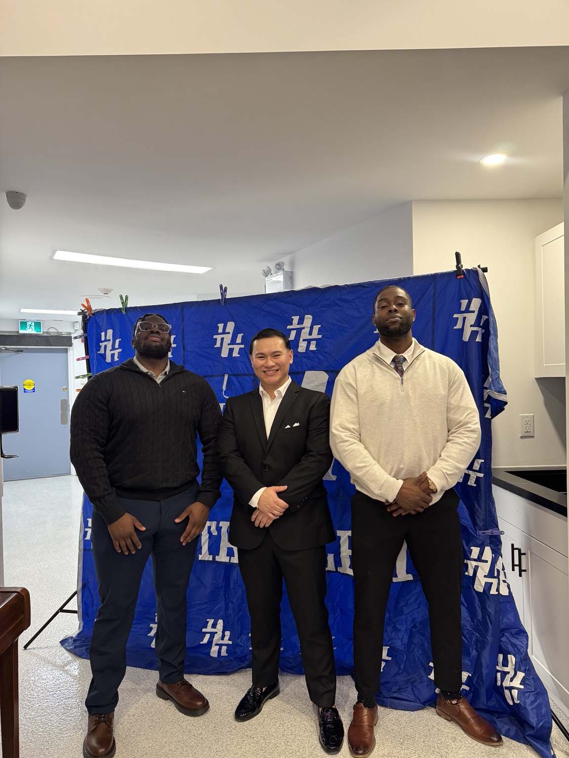 Three guests at an HT Athletic awards event