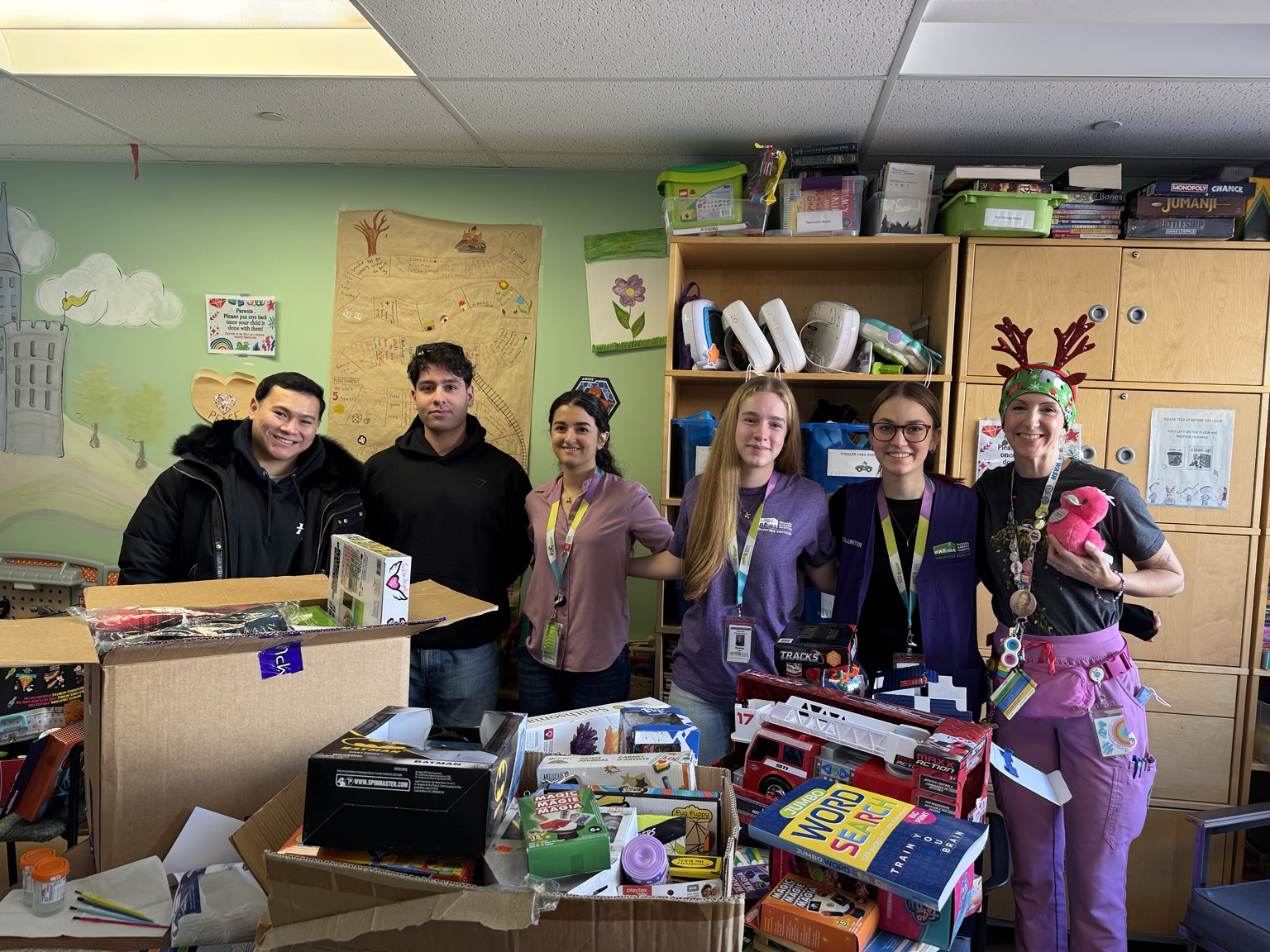 Group with donated supplies at a community centre